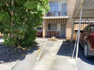 Broadway Apartments front, parking lot