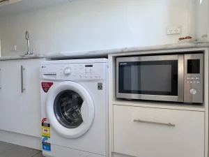 Broadway apartments kitchen microwave & washing machine