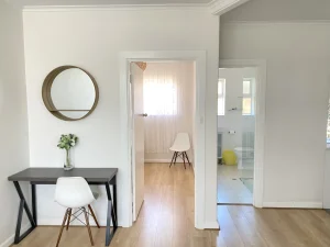 Broadway Apartments lounge with a small table